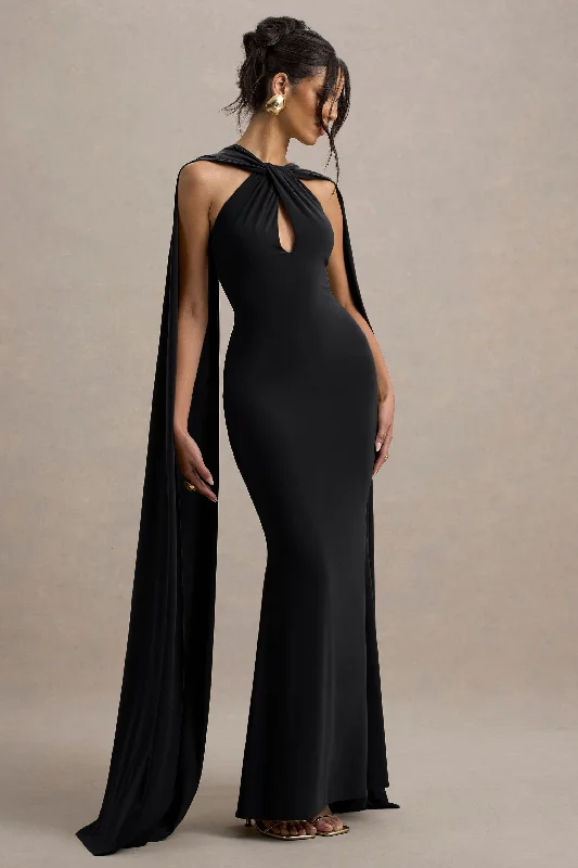 Modern minimalist wedding dresses with clean lines​ Printed wedding guest dresses with tropical motifs for beach weddings Rhoda | Black Twist Halter-Neck Cape Maxi Dress
